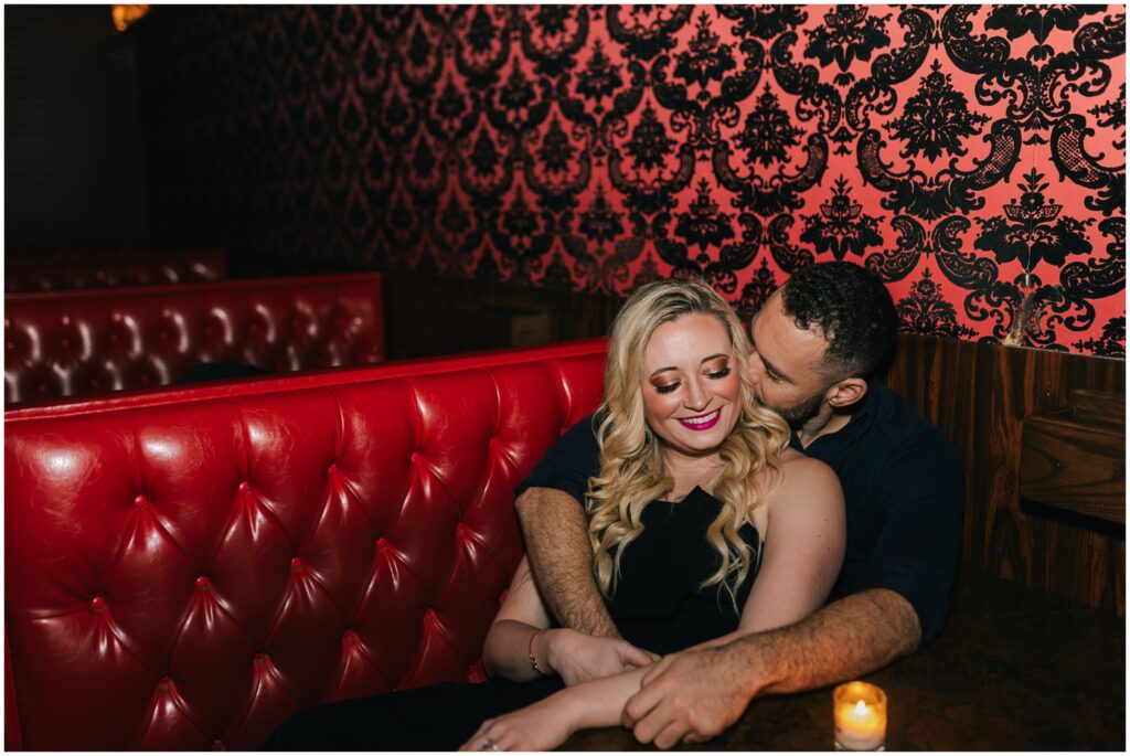 candid engagement photos at a restaurant in philly. 
