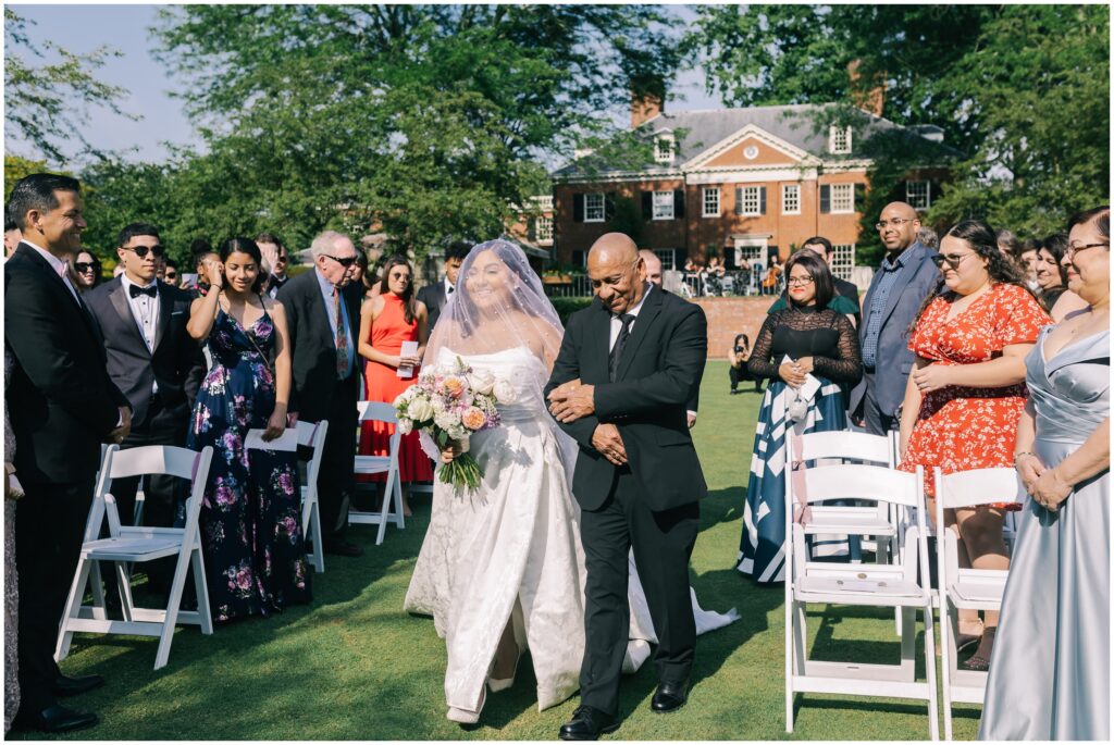 Bride walking down isle at Brantwyn estate